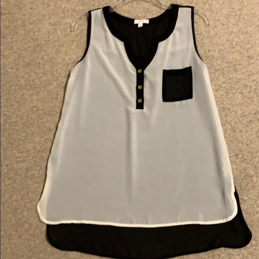 Cute cream and black semi-sheer sleeveless blouse